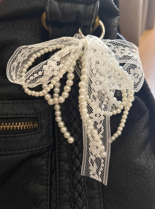 Cutie Charm with a white lace and pearl bow ribbon - Kamuxury