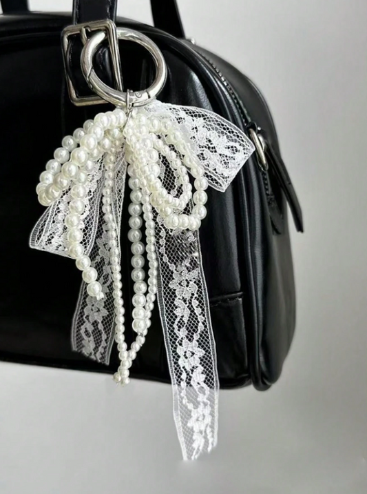 Cutie Charm with a white lace and pearl bow ribbon - Kamuxury